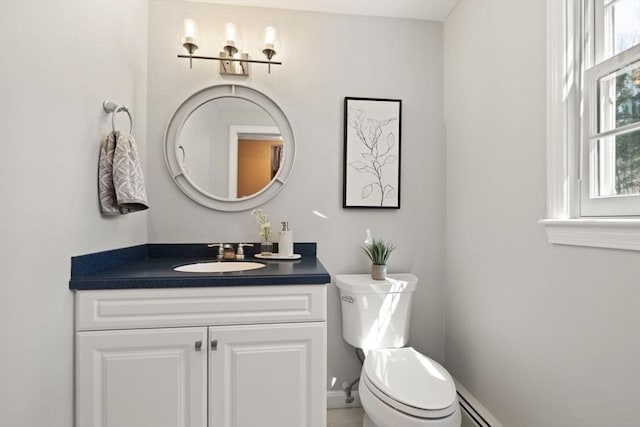 half bathroom with toilet and vanity