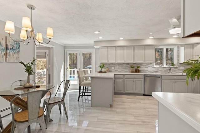 kitchen featuring stainless steel dishwasher, decorative backsplash, ornamental molding, and light countertops
