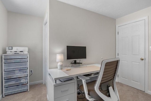 office area with baseboards and light colored carpet