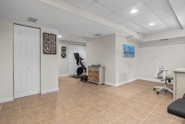 office area featuring a paneled ceiling, light tile patterned floors, baseboards, and recessed lighting