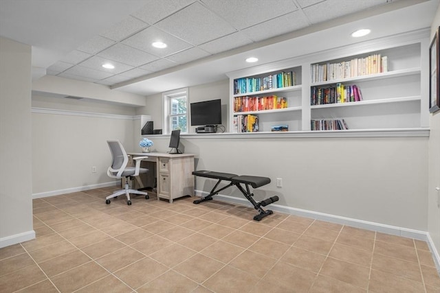 office area featuring recessed lighting, a paneled ceiling, and baseboards