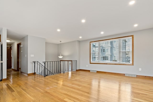 empty room with light wood-type flooring