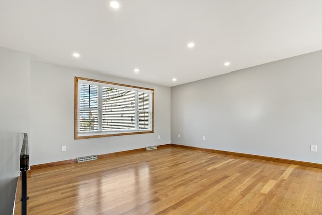 unfurnished room featuring light hardwood / wood-style floors