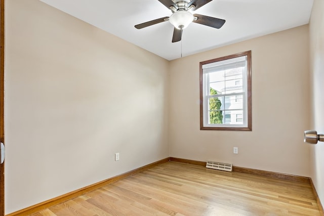 empty room with light wood-type flooring and ceiling fan