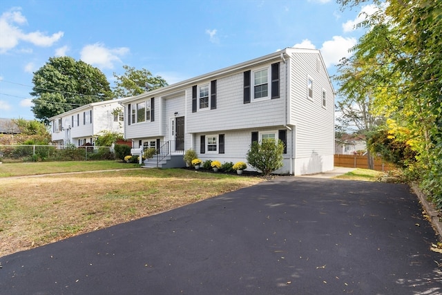 bi-level home with a front yard