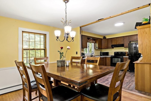 92 Rocky Hill Rd, Rehoboth, MA 02769 - dining room featuring a chandelier, a baseboard radiator, and light wood finished floors