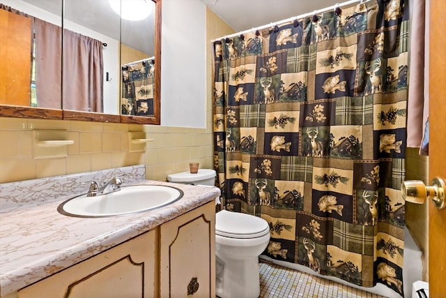 92 Rocky Hill Rd, Rehoboth, MA 02769 - full bath featuring tile walls, toilet, vanity, tile patterned floors, and baseboard heating