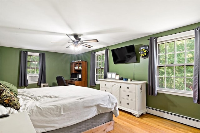 92 Rocky Hill Rd, Rehoboth, MA 02769 - bedroom with baseboard heating, light wood-style floors, multiple windows, and cooling unit