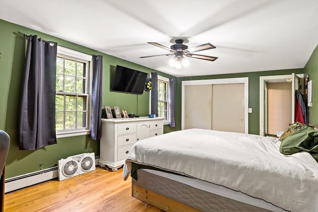 92 Rocky Hill Rd, Rehoboth, MA 02769 - bedroom with a baseboard radiator, light wood-style floors, and ceiling fan