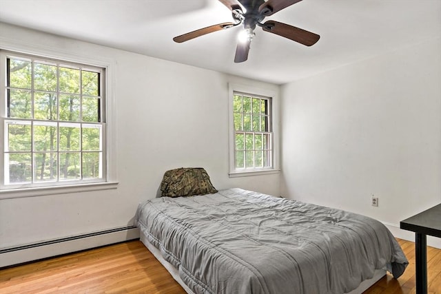 92 Rocky Hill Rd, Rehoboth, MA 02769 - bedroom with wood finished floors, baseboard heating, and a ceiling fan