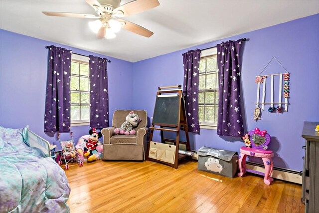 92 Rocky Hill Rd, Rehoboth, MA 02769 - bedroom featuring baseboard heating, wood finished floors, and ceiling fan