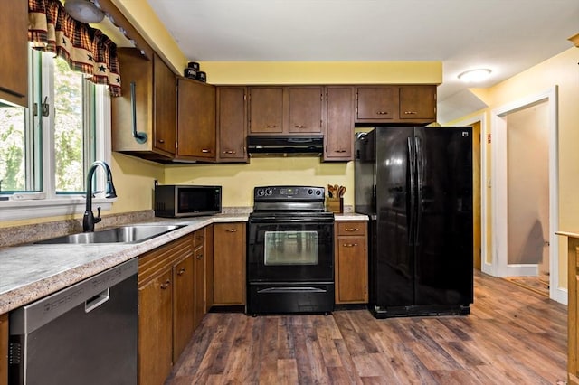 92 Rocky Hill Rd, Rehoboth, MA 02769 - kitchen featuring black appliances, exhaust hood, a sink, light countertops, and dark wood-style floors