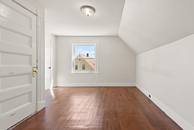 12 Porter St, Everett, MA 02149 - additional living space featuring wood finished floors and vaulted ceiling