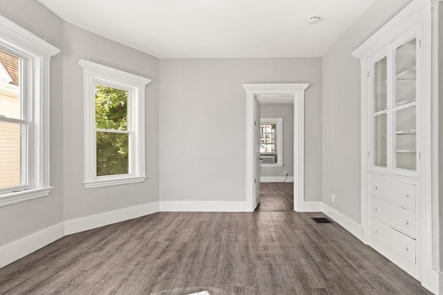 12 Porter St, Everett, MA 02149 - empty room featuring wood finished floors and a smoke detector