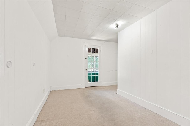12 Porter St, Everett, MA 02149 - carpeted spare room featuring wood walls