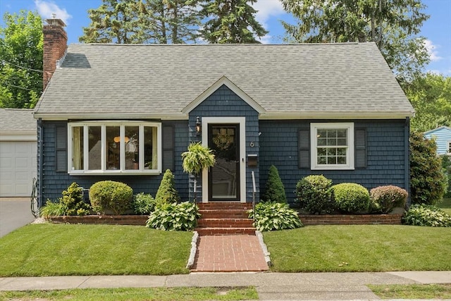 6 Hayes Rd, Salem, MA 01970 - view of front facade with a chimney, a front lawn, a garage, and roof with shingles