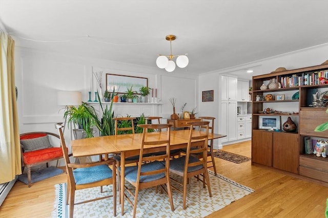 6 Hayes Rd, Salem, MA 01970 - dining area featuring light wood-style floors, a chandelier, and crown molding