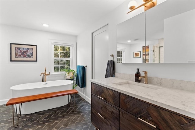 6 Hayes Rd, Salem, MA 01970 - full bath featuring vanity, a freestanding tub, and recessed lighting