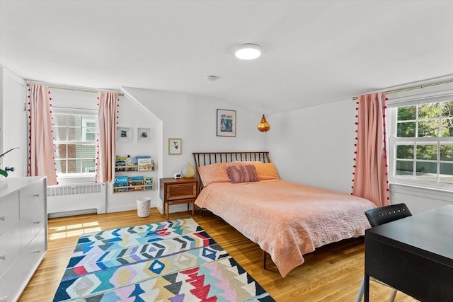 6 Hayes Rd, Salem, MA 01970 - bedroom with radiator heating unit, wood finished floors, and lofted ceiling