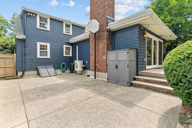 6 Hayes Rd, Salem, MA 01970 - back of property featuring a patio area and a chimney
