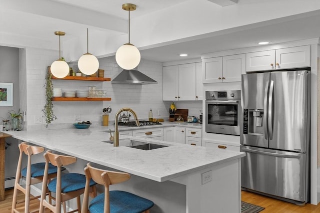 6 Hayes Rd, Salem, MA 01970 - kitchen featuring stainless steel appliances, a peninsula, white cabinets, backsplash, and a breakfast bar area