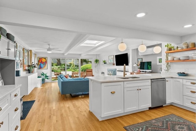 6 Hayes Rd, Salem, MA 01970 - kitchen featuring stainless steel dishwasher, open floor plan, a peninsula, light countertops, and beamed ceiling