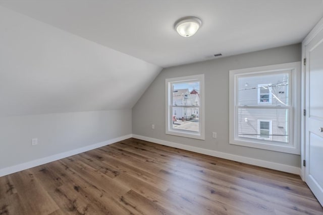 46 Lyons St, Lowell, MA 01852 - bonus room featuring wood finished floors, baseboards, and vaulted ceiling