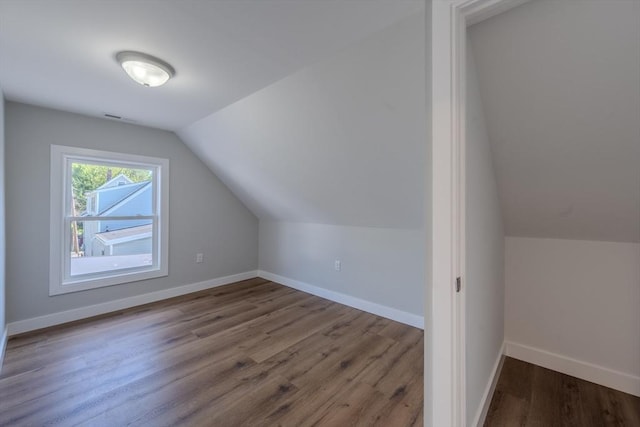 46 Lyons St, Lowell, MA 01852 - additional living space featuring lofted ceiling, wood finished floors, and baseboards