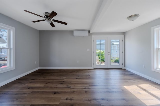 46 Lyons St, Lowell, MA 01852 - spare room featuring an AC wall unit, wood finished floors, french doors, baseboards, and ceiling fan