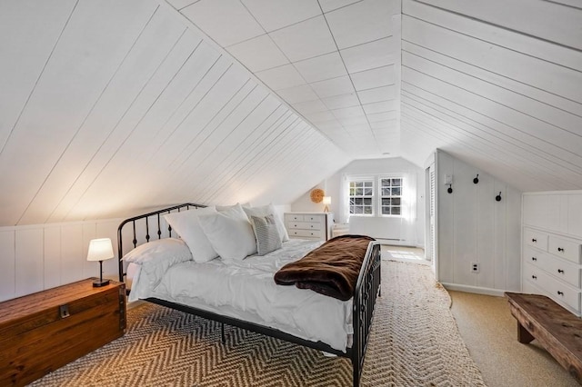 carpeted bedroom featuring lofted ceiling