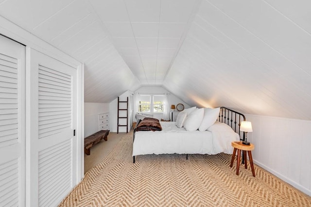 carpeted bedroom with vaulted ceiling