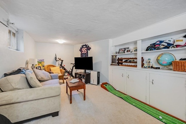 living area with light colored carpet and a textured ceiling