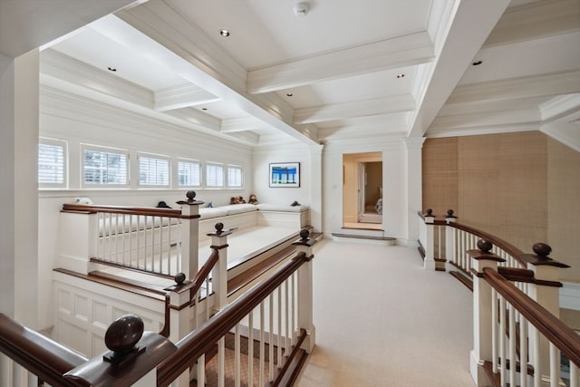 corridor with light colored carpet, plenty of natural light, coffered ceiling, and beamed ceiling