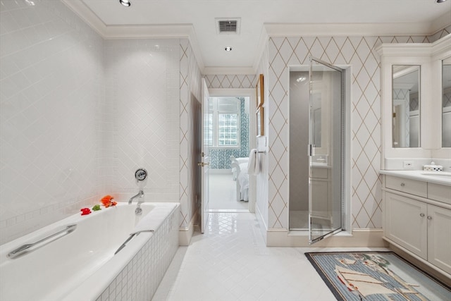 bathroom with ornamental molding, tile flooring, tile walls, and large vanity