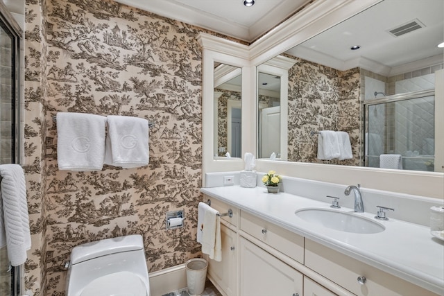 bathroom featuring vanity, toilet, and crown molding