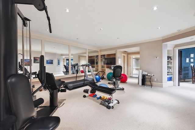 exercise area featuring built in features, crown molding, and carpet