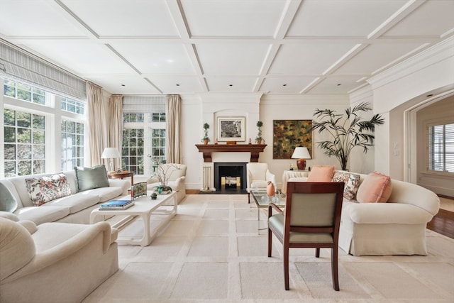 living room featuring plenty of natural light and coffered ceiling