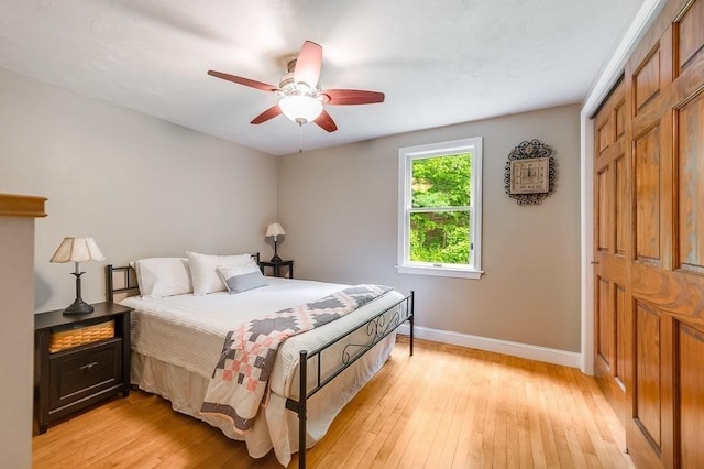 2470 W St, Wrentham, MA 02093 - bedroom with baseboards, light wood-style flooring, a ceiling fan, and a closet