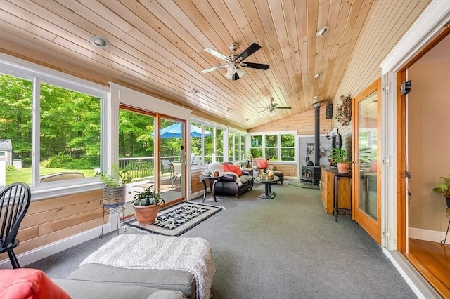 2470 W St, Wrentham, MA 02093 - sunroom featuring lofted ceiling, ceiling fan, and a wood stove