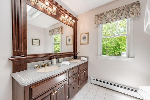 2470 W St, Wrentham, MA 02093 - bathroom featuring a baseboard heating unit, double vanity, toilet, and tile patterned floors