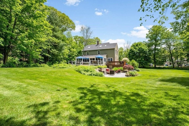 2470 W St, Wrentham, MA 02093 - rear view of house with a patio, a lawn, a wooden deck, and outdoor lounge area