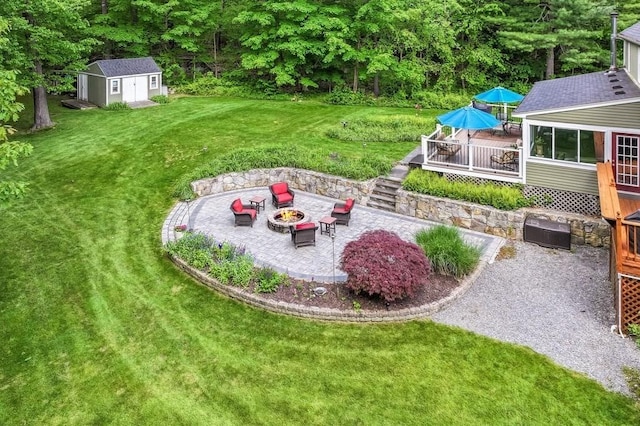 2470 W St, Wrentham, MA 02093 - view of green lawn featuring an outdoor fire pit, a patio area, a deck, an outbuilding, and stairway