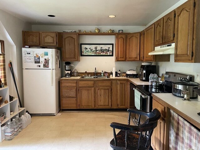 127 Depot Rd, Boxford, MA 01921 - kitchen with freestanding refrigerator, under cabinet range hood, a sink, and light countertops