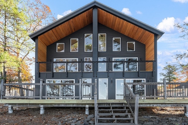 back of house featuring a wooden deck