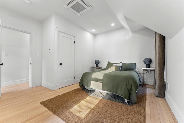 bedroom with wood-type flooring