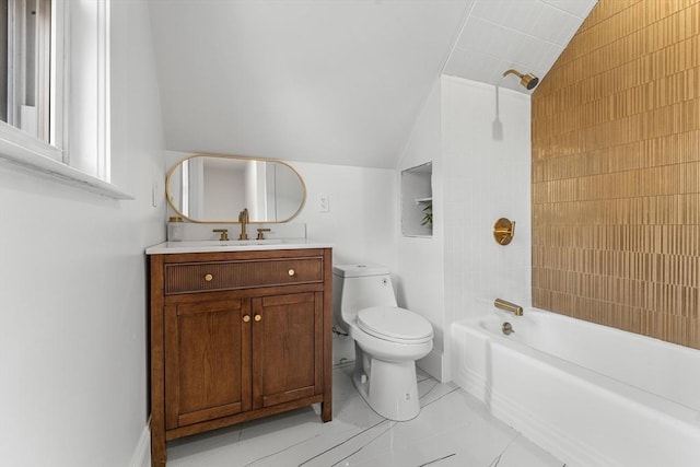 full bathroom with vanity, washtub / shower combination, vaulted ceiling, tile patterned flooring, and toilet