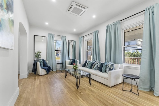 living room with light hardwood / wood-style flooring