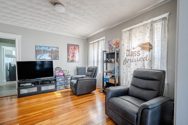 69-71 Pond St, Waltham, MA 02451 - living room featuring hardwood / wood-style flooring and crown molding