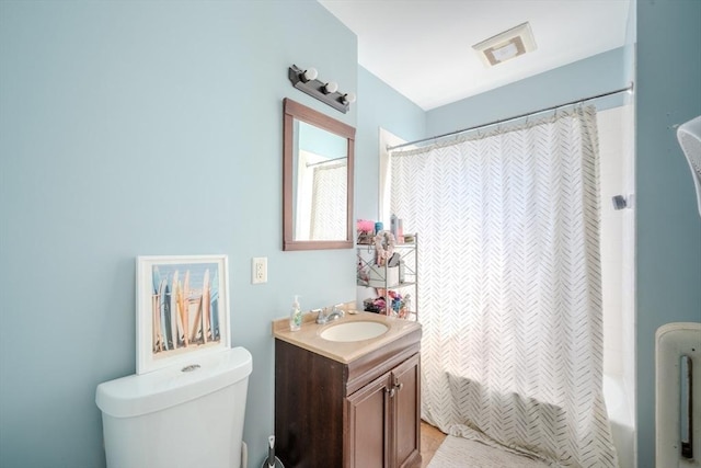 69-71 Pond St, Waltham, MA 02451 - full bathroom with toilet, vanity, and shower / tub combo with curtain