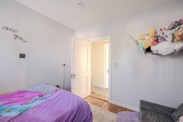69-71 Pond St, Waltham, MA 02451 - bedroom featuring light wood-style floors and baseboards